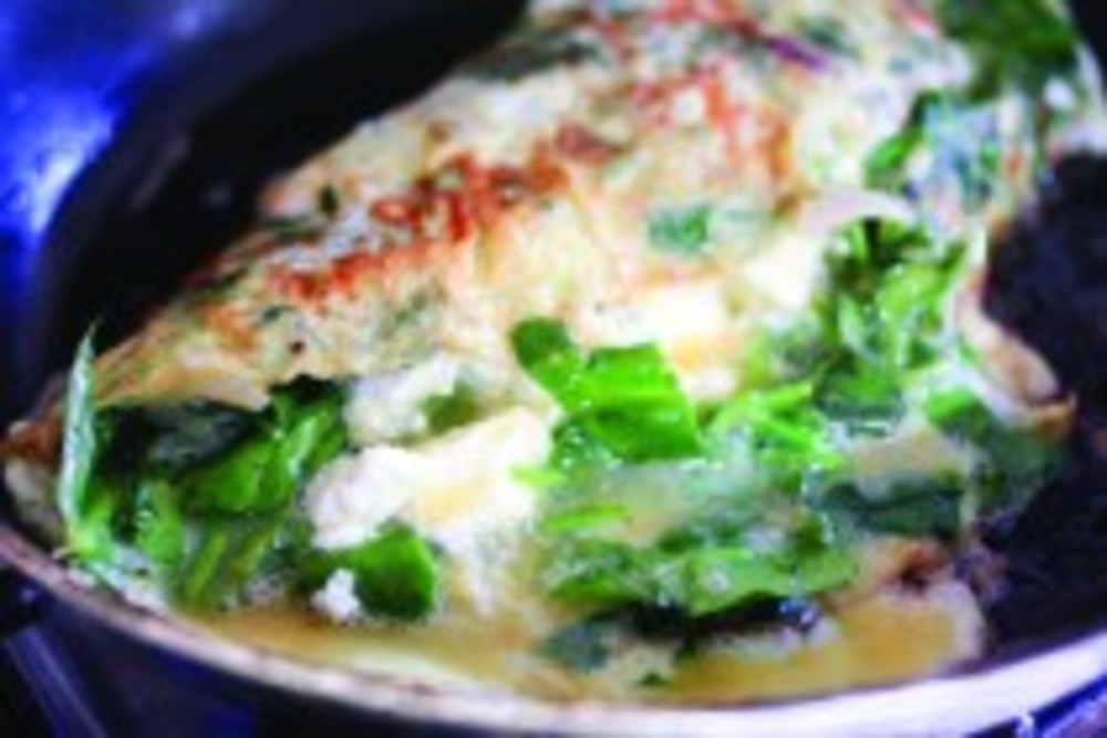 This vegetable rich omelet looks easy to make and delicious to eat.